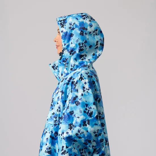 Unisex festival poncho with blue dazzle abstract pattern, hooded design, lightweight waterproof raincoat for outdoor activities.