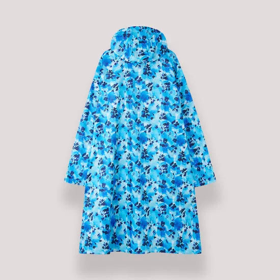 Unisex festival poncho in blue daze floral print, waterproof and lightweight, ideal for outdoor events and rainy days.