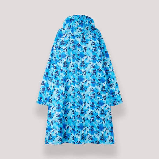 Unisex festival poncho in blue daze floral print, waterproof and lightweight, ideal for outdoor events and rainy days.