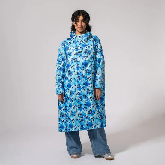 Unisex blue floral festival poncho, waterproof, mid-length raincoat with hood, casual style, oversized fit.