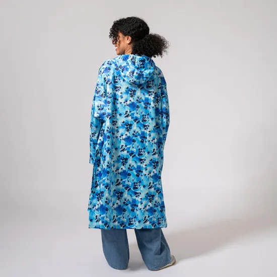 Unisex festival poncho in blue daze floral pattern, lightweight, waterproof, Hooded, stylish rain Protection for outdoor events.