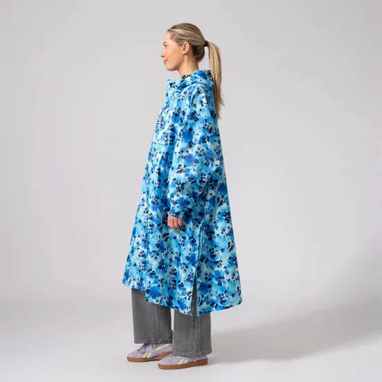 Unisex blue daze festival poncho with hood, oversized fit, lightweight waterproof fabric, ideal for outdoor events.