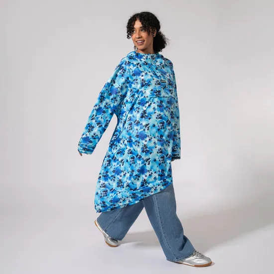 Unisex blue Daze festival poncho by Mac In A Sac, oversized waterproof raincoat with floral print, casual streetwear style.