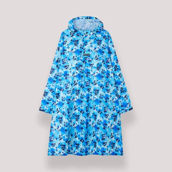 Unisex festival rain poncho in blue Daze floral print with hood, lightweight waterproof material, knee-length, casual tribute to outdoor event wear.
