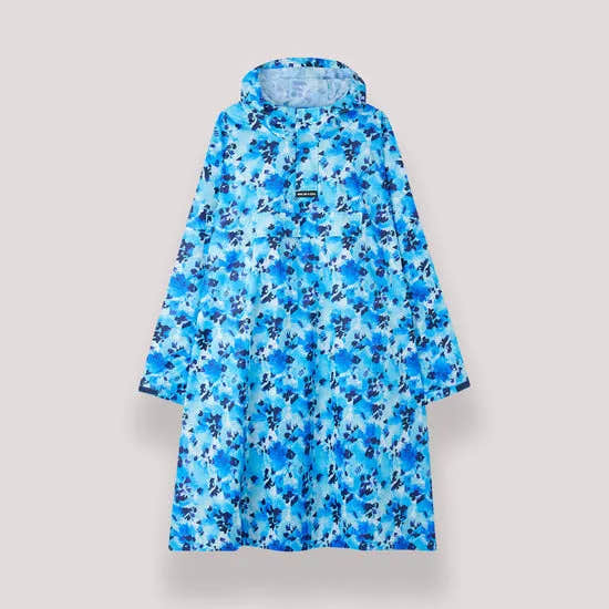 Unisex festival rain poncho in blue Daze floral print with hood, lightweight waterproof material, knee-length, casual tribute to outdoor event wear.