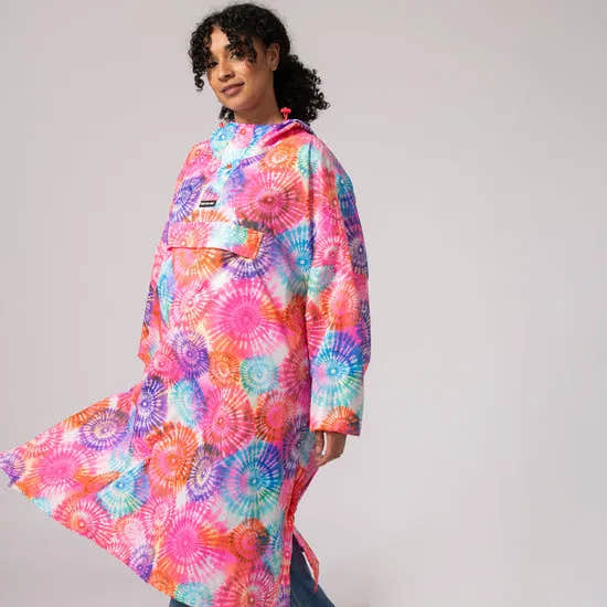 Unisex festival poncho with tie-dye spiral pattern, vibrant pink, orange, blue, and purple colors, loose fit, outdoor wear.