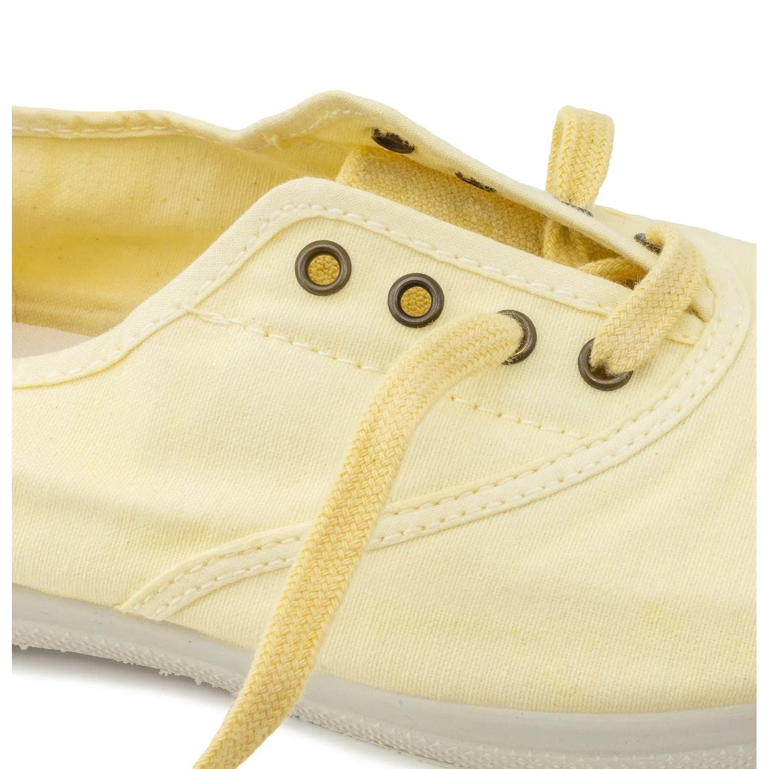 Natural World 102E Ladies Vegan Slip-On Shoes in yellow textile with metal eyelets and matching laces.
