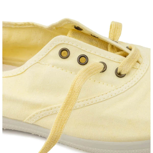 Natural World 102E Ladies Vegan Slip-On Shoes in yellow textile with metal eyelets and matching laces.