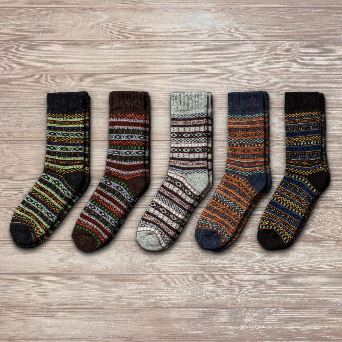 Unisex Nordic wool socks in grey, brown, navy, and multicolor patterns, ideal for winter wear.