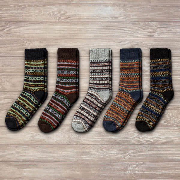 Unisex Nordic wool socks in grey, brown, navy, and multicolor patterns, ideal for winter wear.