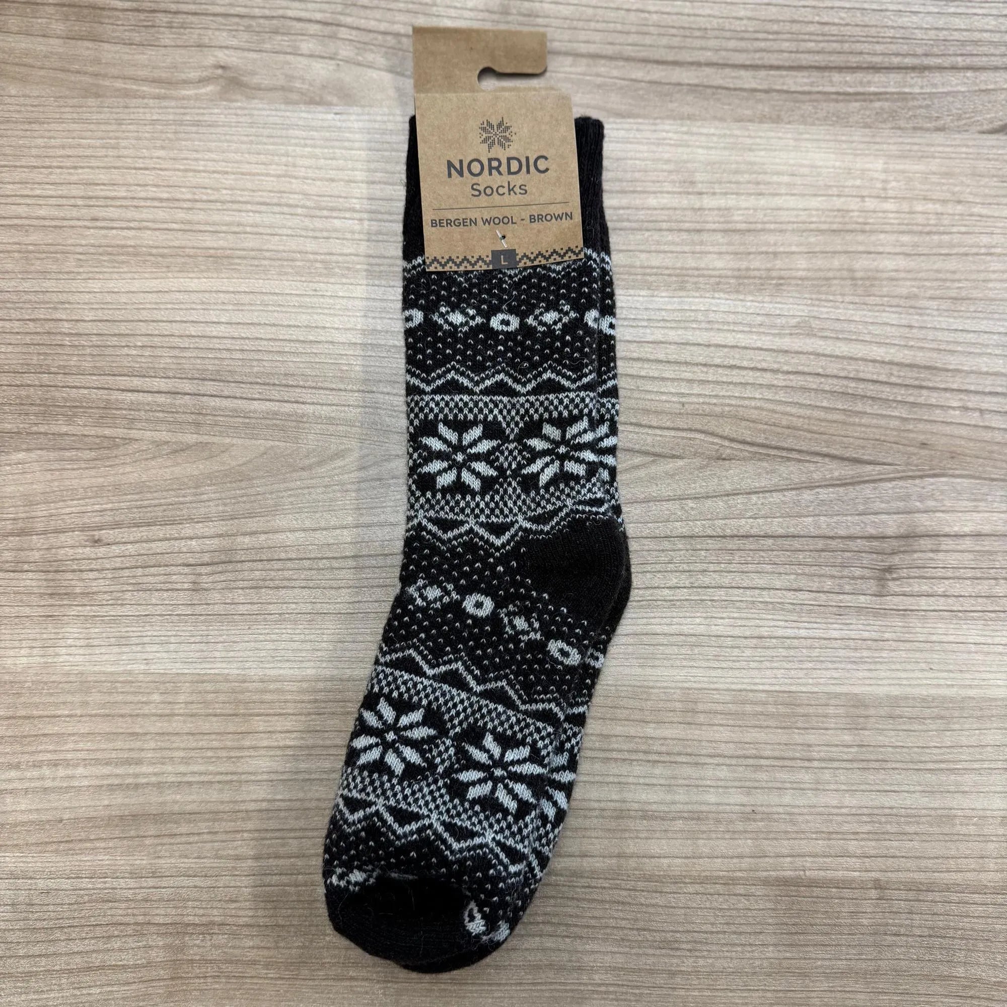 Unisex Bergen wool sock in brown with Nordic snowflake and geometric patterns, stylish and warm.
