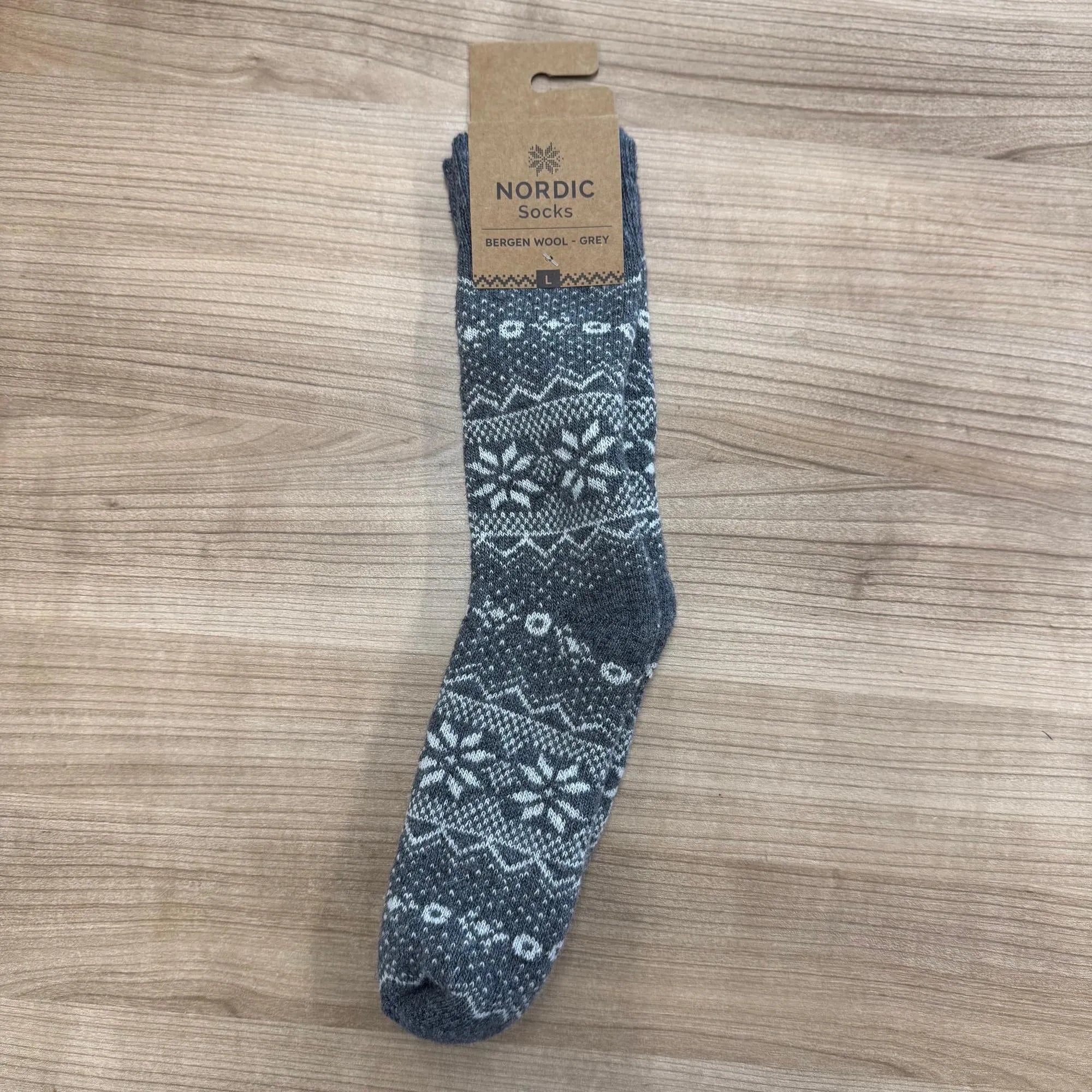 Unisex Bergen wool grey Nordic sock with winter snowflake and mountain pattern, made from cozy wool.