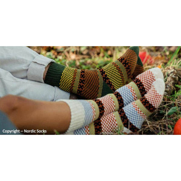 Unisex Nordic wool socks in green, orange, and red with Nordic patterns, suitable for outdoor wear.