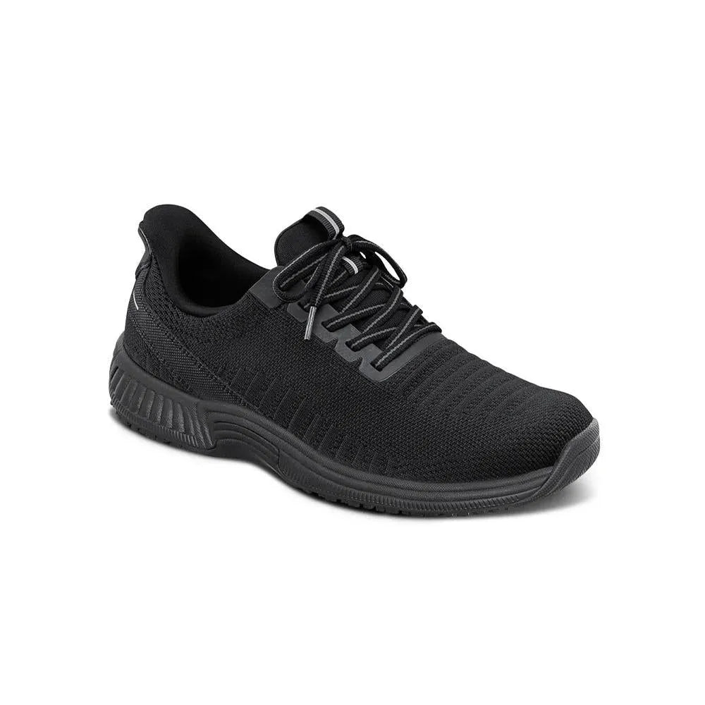 OrthoFeet Kita Ladies' black textile arch support trainers with wide elasticated fit and cushioned sole.
