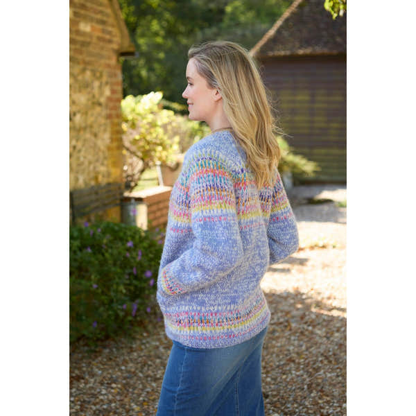Pachamama Arundel Cardigan Sky, multicolor knitted sweater, long sleeves, cozy fit, outdoor setting.