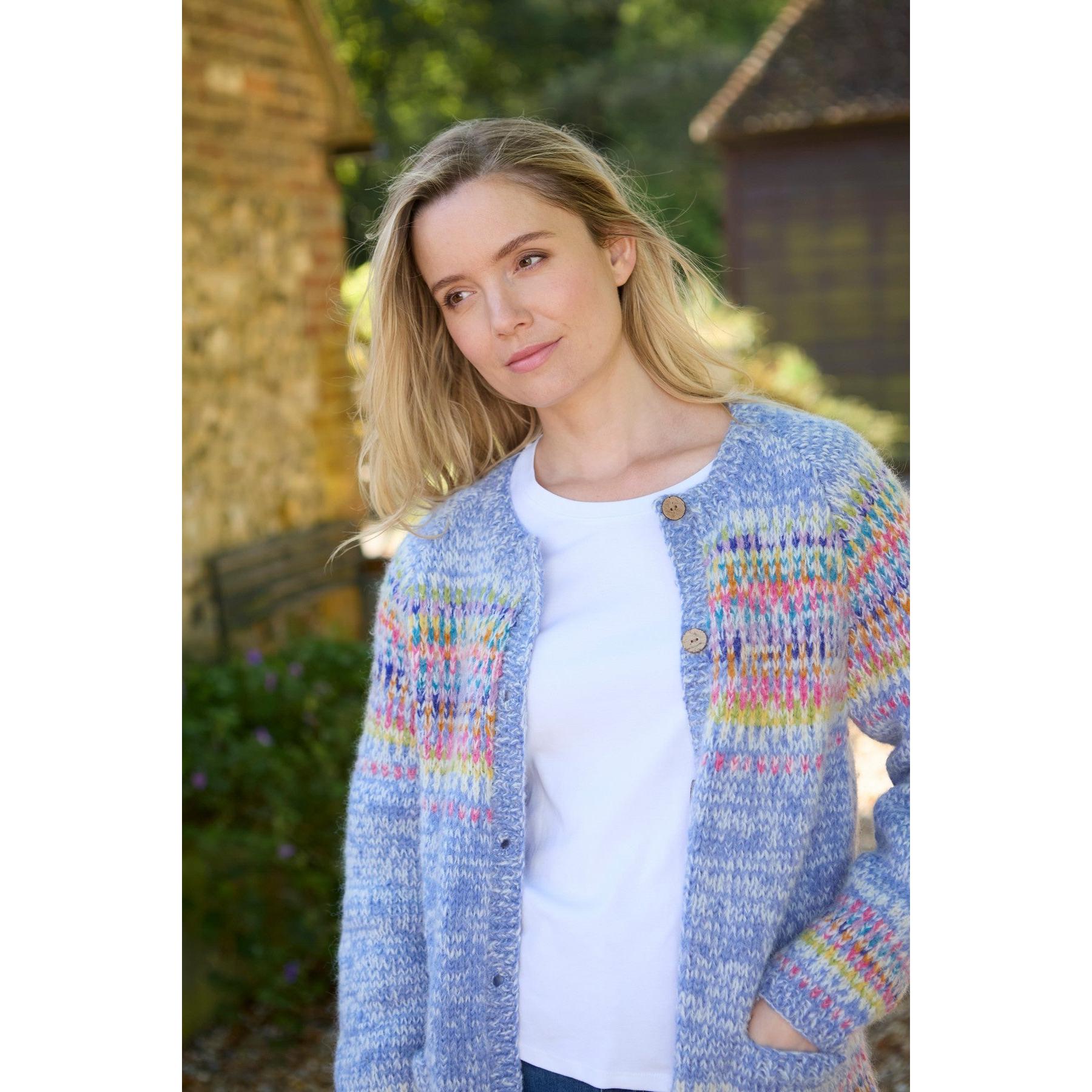 Pachamama Arundel Cardigan Sky in pastel knit with colorful pattern, worn by woman outdoors, lightweight, casual women's cardigan.