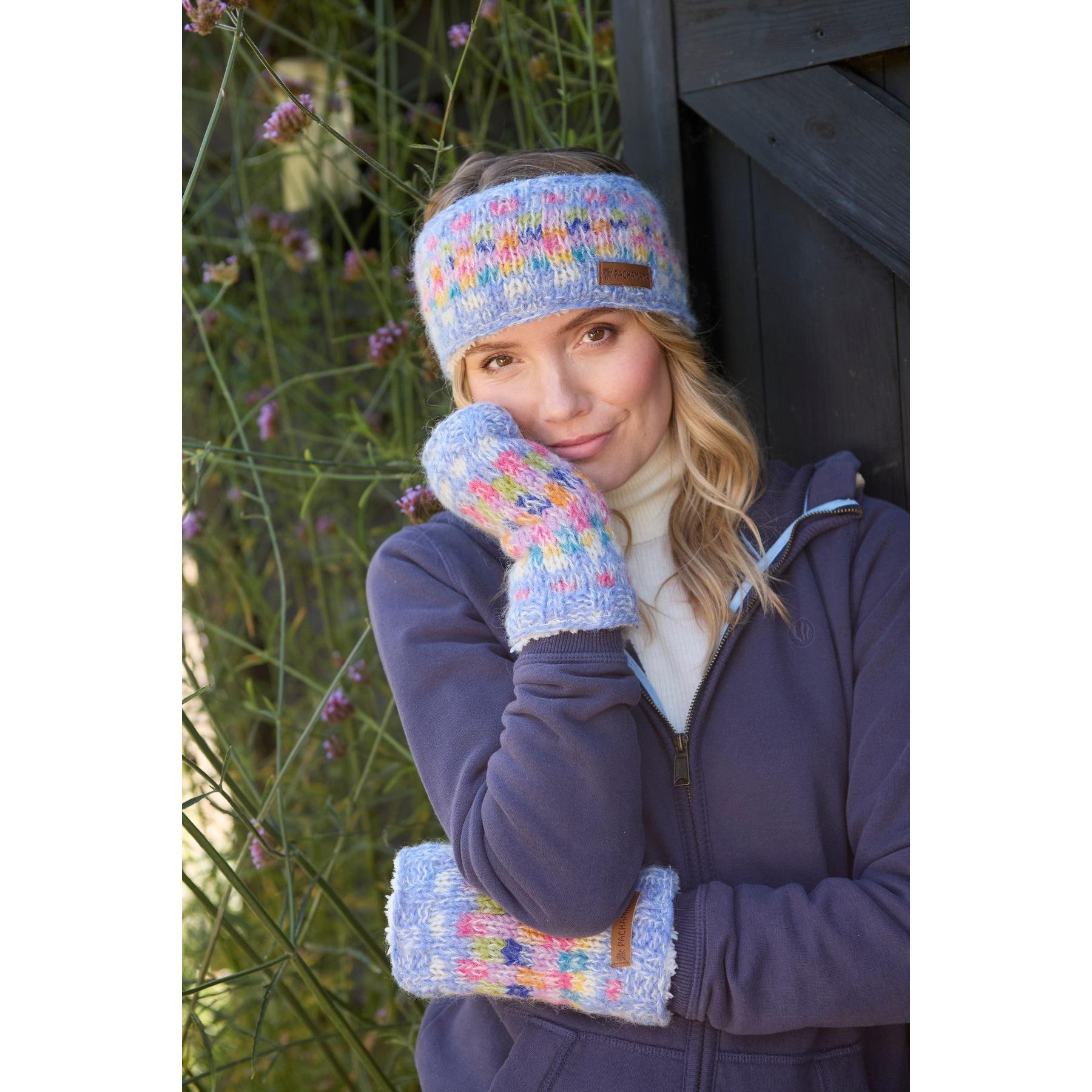 Pachamama Arundel Sky headband and mittens set in colorful knit pattern worn by woman outdoors.