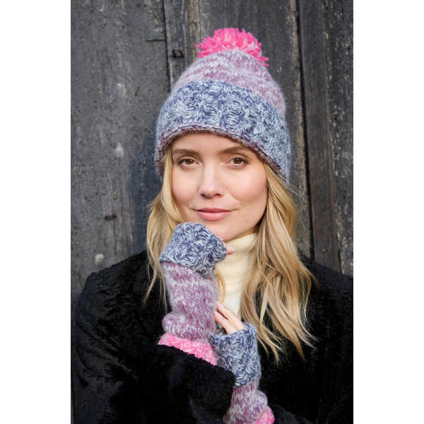 Pachamama Berlin purple bobble beanie with pink accents, knit texture, and matching fingerless gloves, cozy winter accessory.
