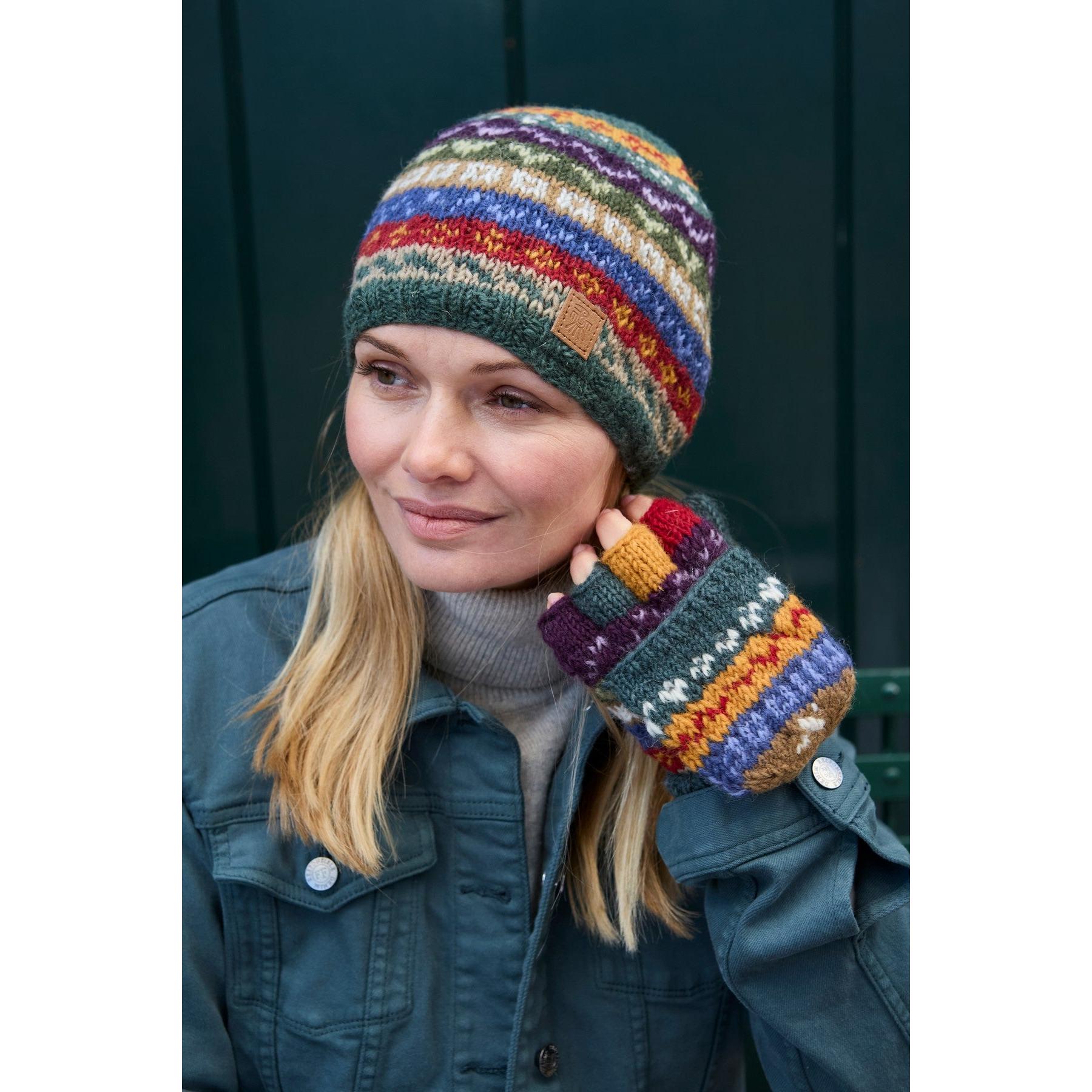 Pachamama Elveden beanie and mittens set, colorful knit wool accessories, woman wearing outdoors, cozy winter style.