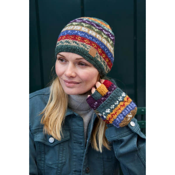 Pachamama Elveden beanie and mittens set, colorful knit wool accessories, woman wearing outdoors, cozy winter style.