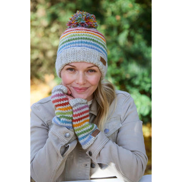 Pachamama Hoxton Stripe Bobble Beanie and matching gloves in colorful rainbow stripes, made of pure Merino wool.