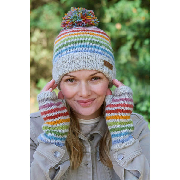 Pachamama Hoxton Stripe hand warmer set with multicolor stripes, knit merino wool, and pom-pom beanie for cold weather.