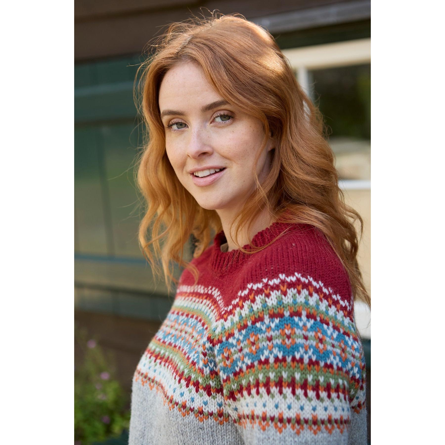 Pachamama Iona Sweater Burgundy with colorful patterned yoke, woman outdoors, cozy knitwear, fall fashion, stylish and warm.