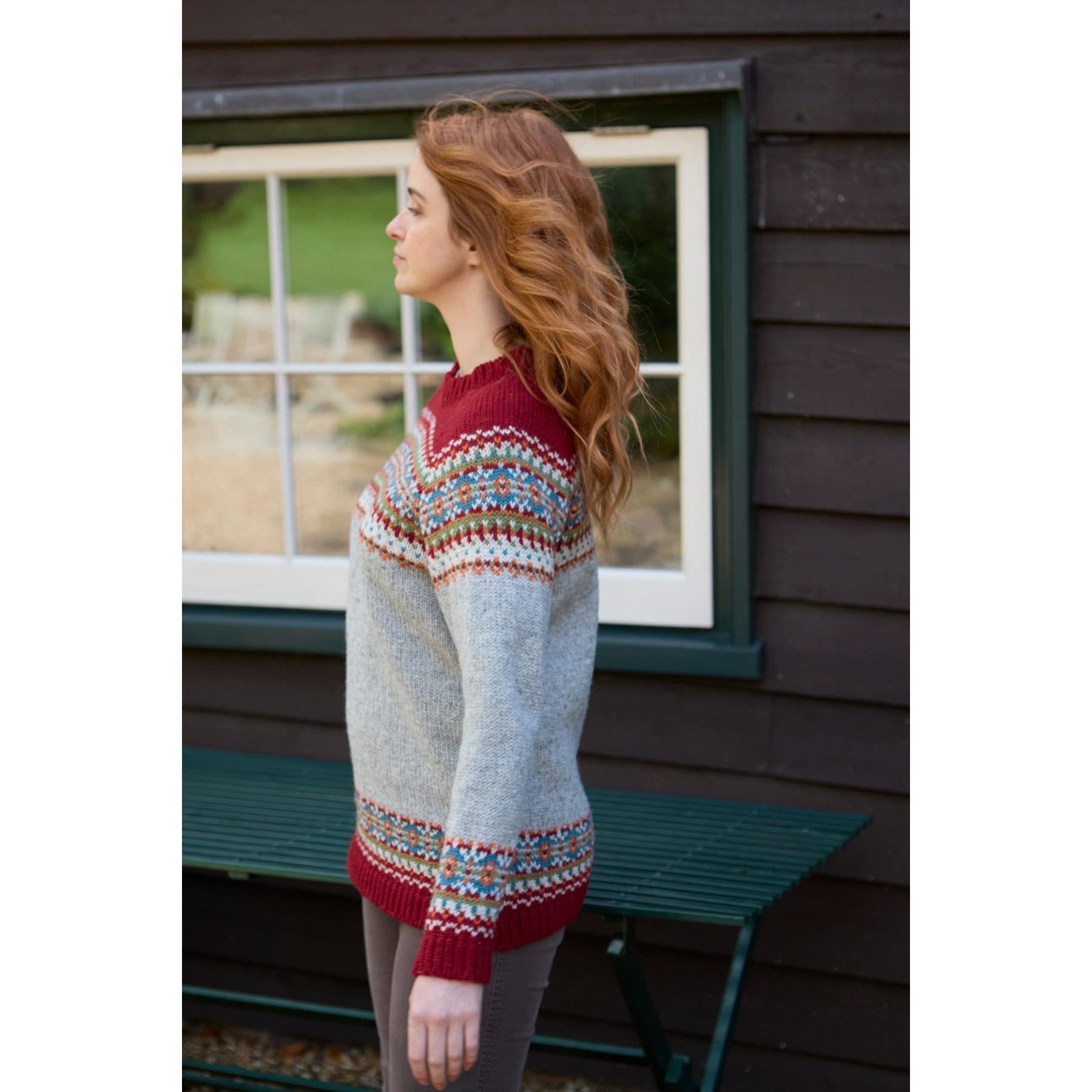 Pachamama Iona Sweater Burgundy and Gray with colorful Fair Isle pattern, long sleeves, knit texture, women, outdoor setting.