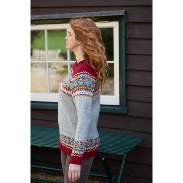 Pachamama Iona Sweater Burgundy and Gray with colorful Fair Isle pattern, long sleeves, knit texture, women, outdoor setting.