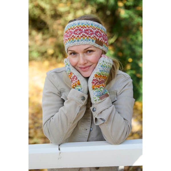 Woman wearing Pachamama Killarney Pure Merino oatmeal-colored headband and matching gloves, outdoor fall setting.