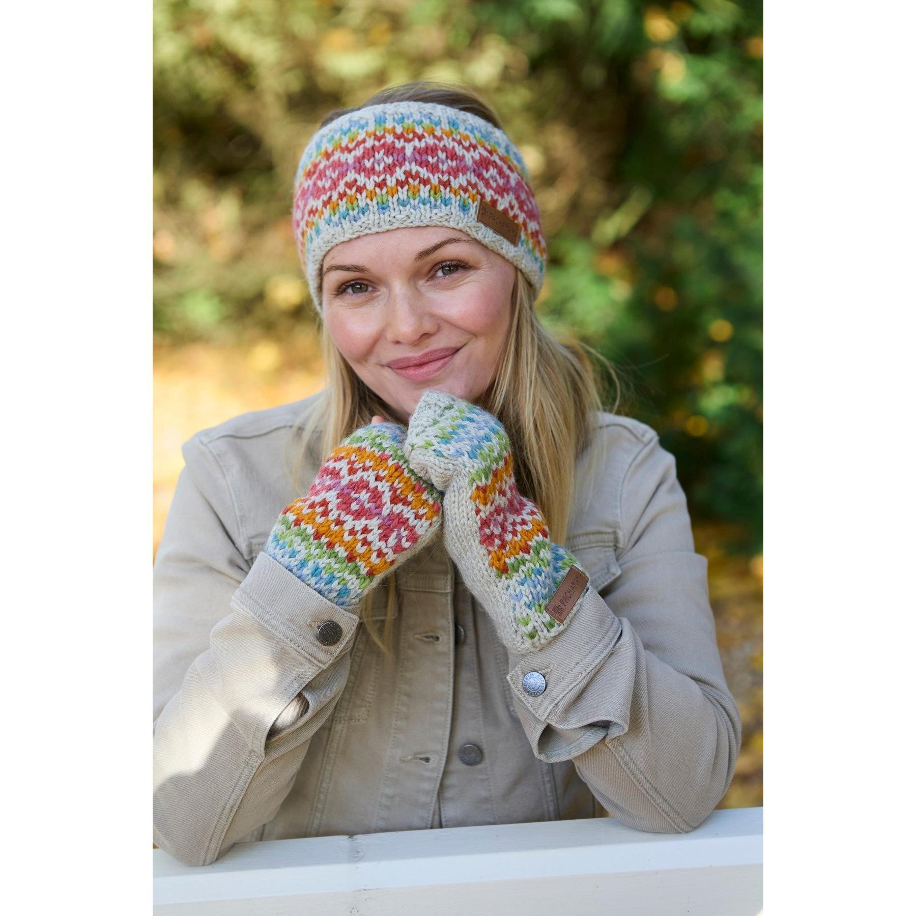Pachamama Killarney Headband and gloves set in oatmeal with colorful knit pattern, made of pure Merino wool, outdoor autumn scenery.