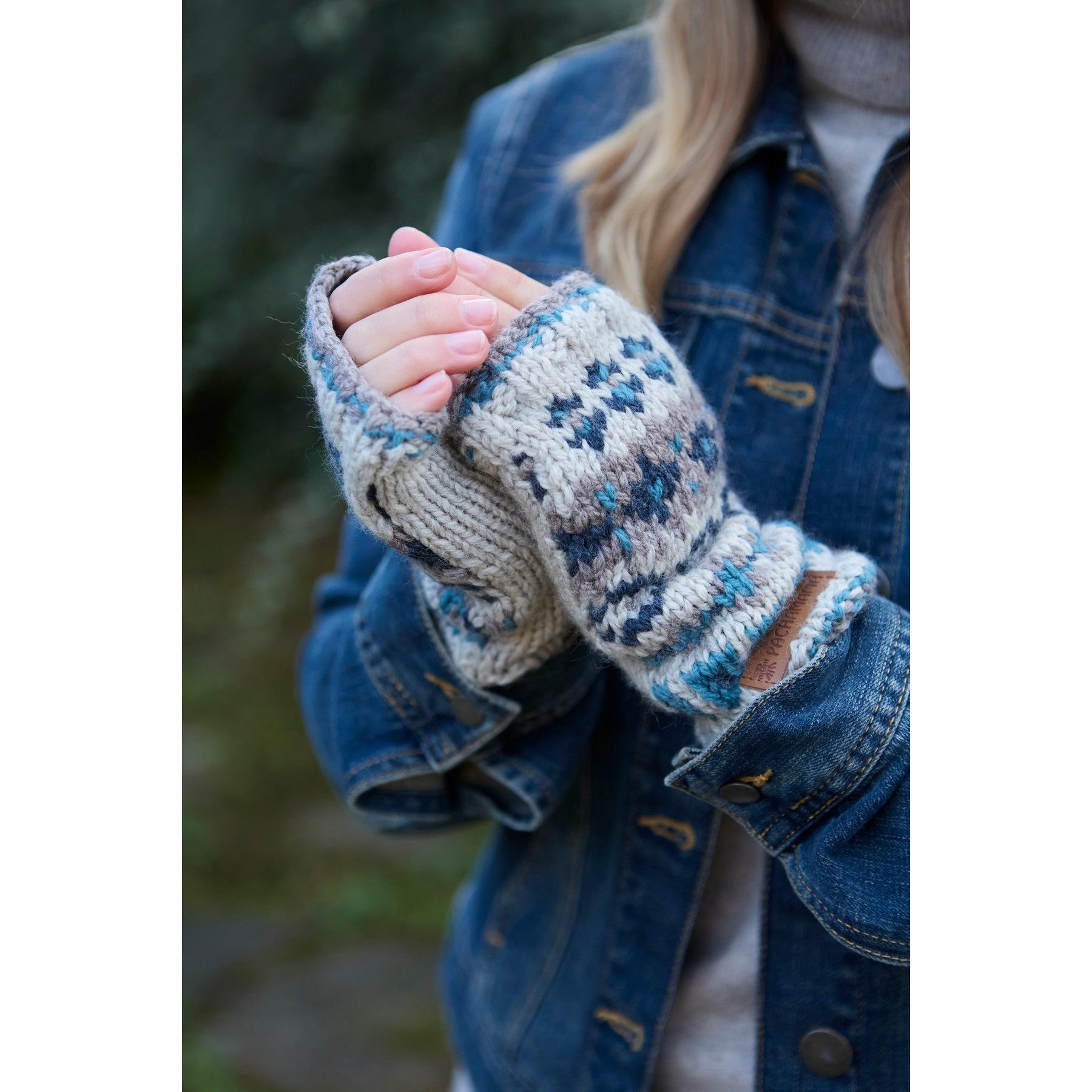 Pachamama Loch Fyne Handwarmer in blue, featuring pure merino wool with traditional patterned knit, worn on a person’s hand.
