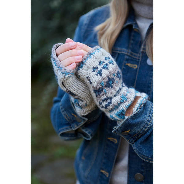Pachamama Loch Fyne Handwarmer in blue, featuring pure merino wool with traditional patterned knit, worn on a person’s hand.
