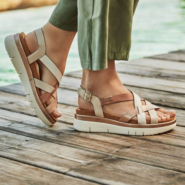 Pikolinos Palma W4N-0650C1 women's brendy leather buckle sandals on wooden dock.