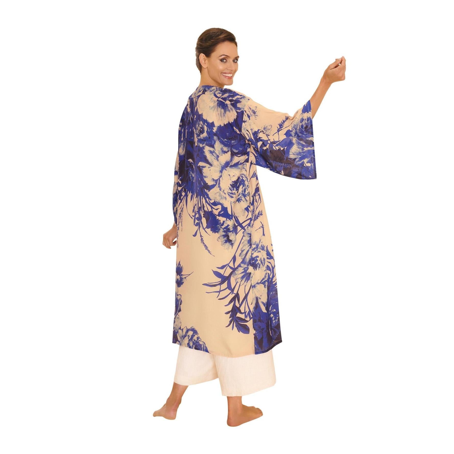 Women’s powder blue kimono gown with floral print, China blue blooms, flowing sleeves, and beige lining.