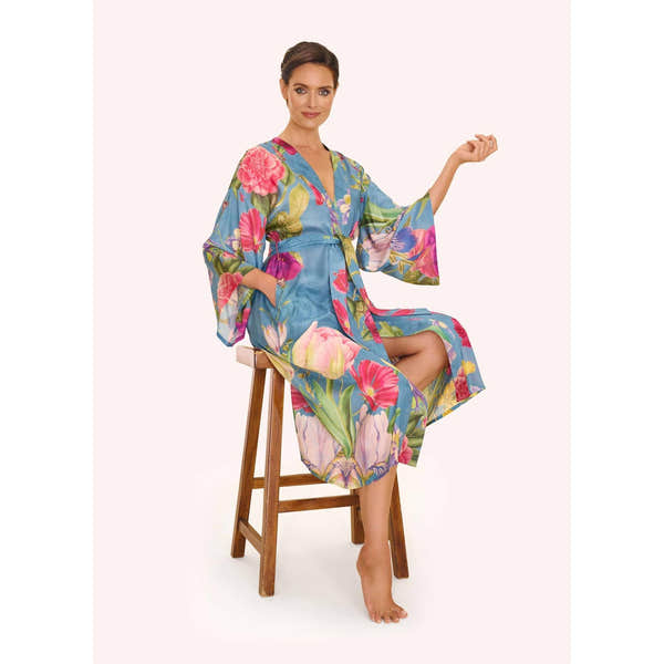 Women's floral study denim kimono gown with a relaxed fit, vibrant flower pattern, and wide sleeves.