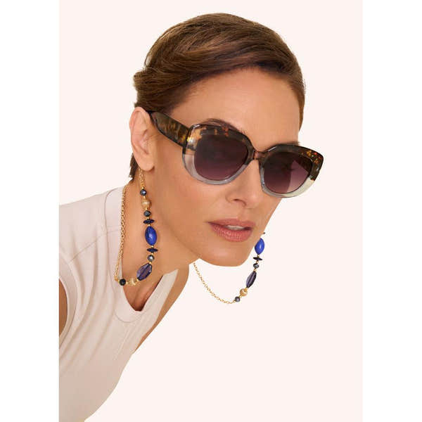 Powder Polina Ltd Edition sunglasses with tortoiseshell and aqua frames, dark gradient lenses, and stylish jewelry.