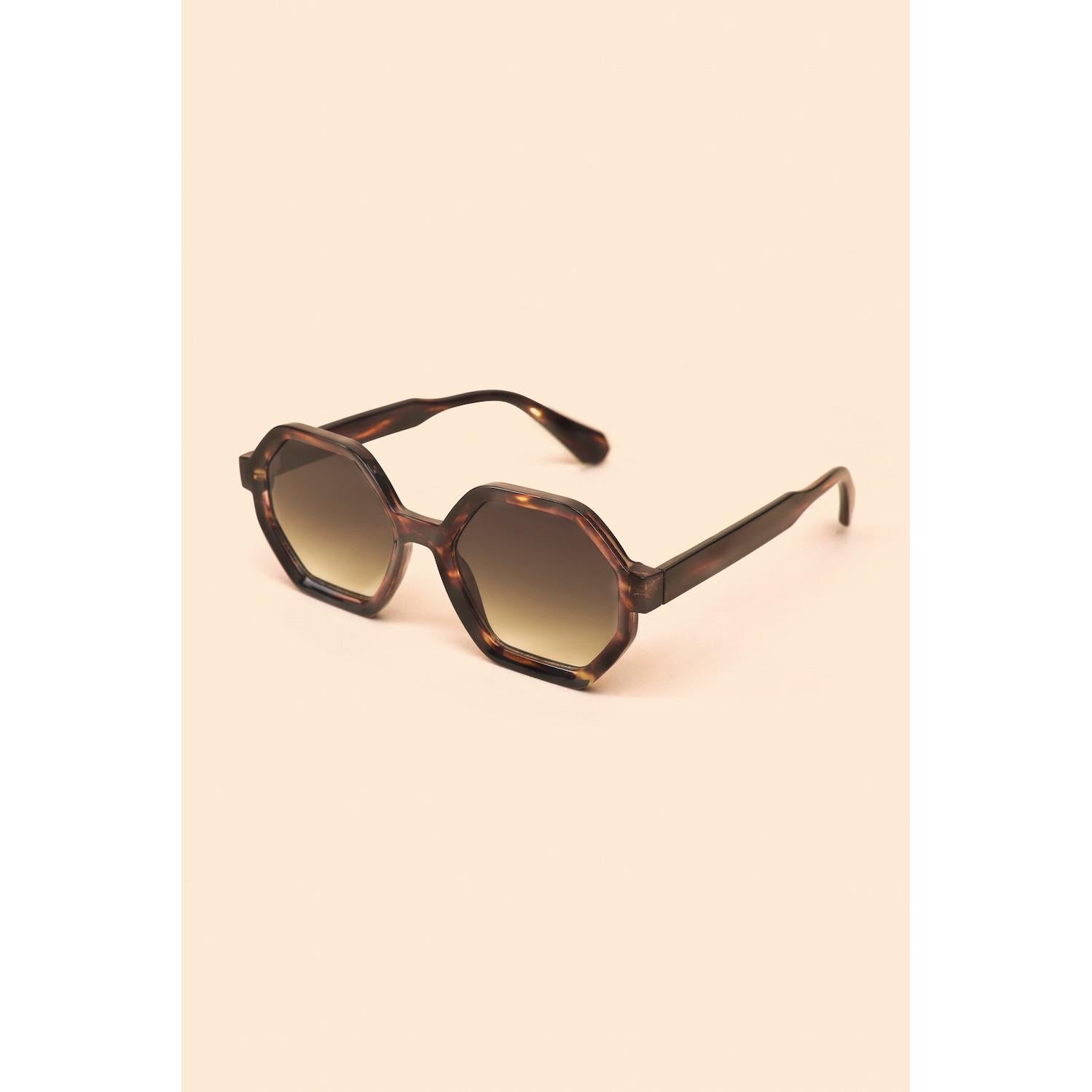 Powder Raven Ltd Edition tortoiseshell sunglasses with gradient lenses and hexagonal frames.