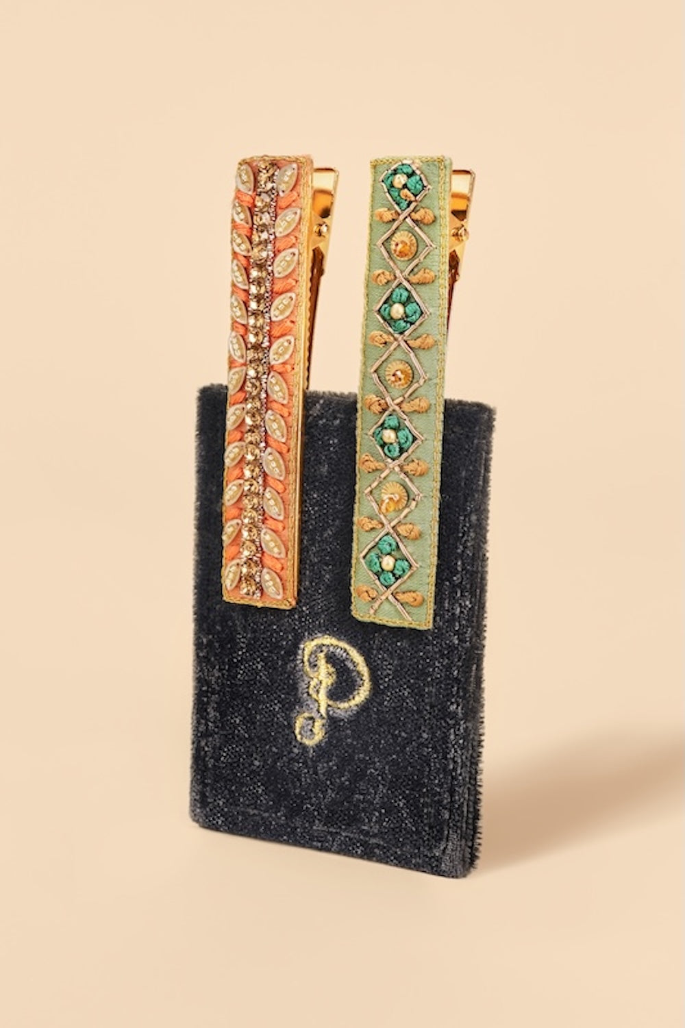 Powder ribbon and strike narrow jeweled bar hair clips, pack of 2, with gold-tone detailing, floral and geometric designs, and sparkling embellishments.