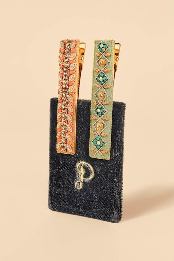 Powder ribbon and strike narrow jeweled bar hair clips, pack of 2, with gold-tone detailing, floral and geometric designs, and sparkling embellishments.