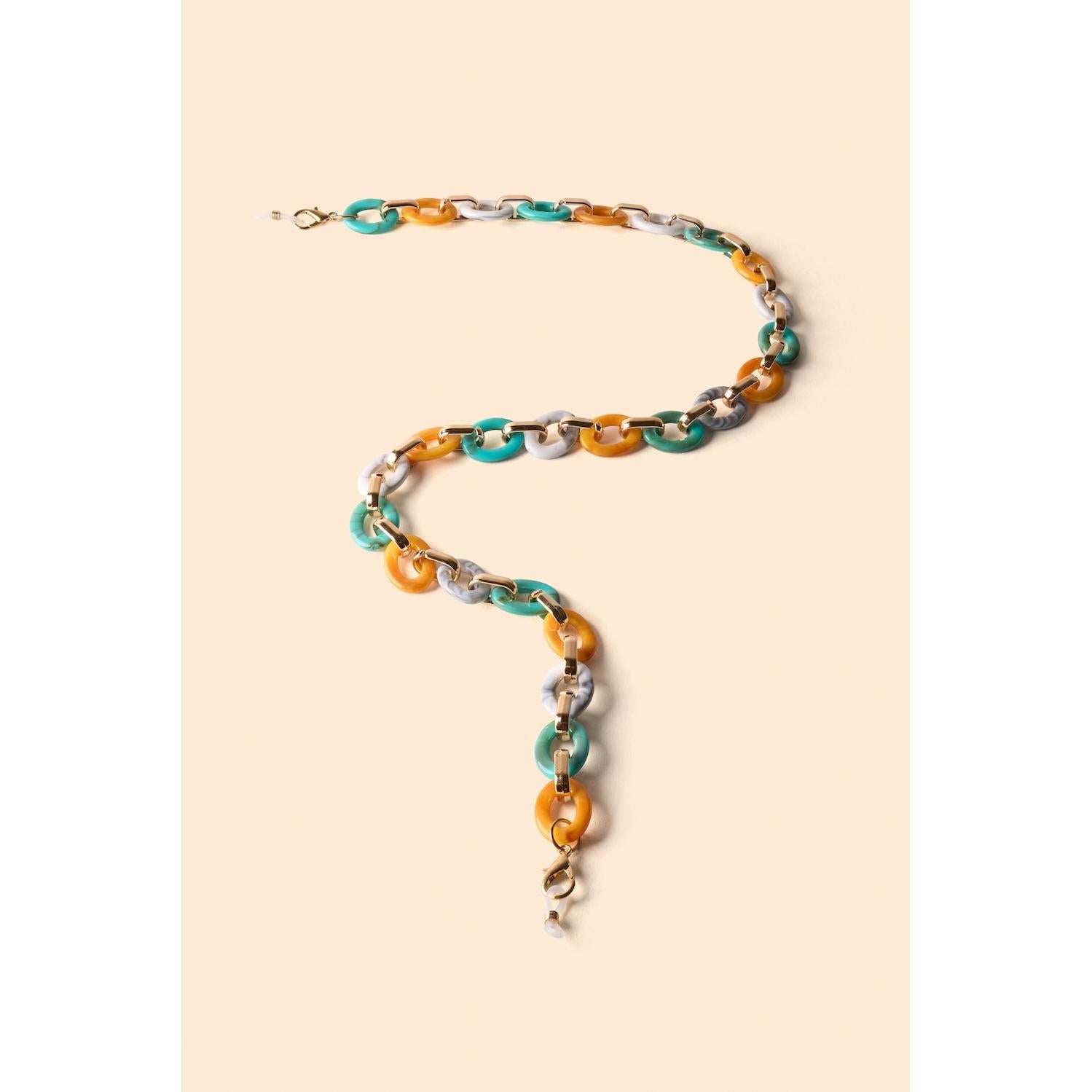 Powder turquoise and mustard link sunglasses chain with gold hardware on beige background.