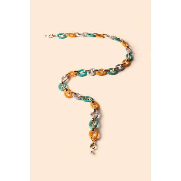 Powder turquoise and mustard link sunglasses chain with gold hardware on beige background.
