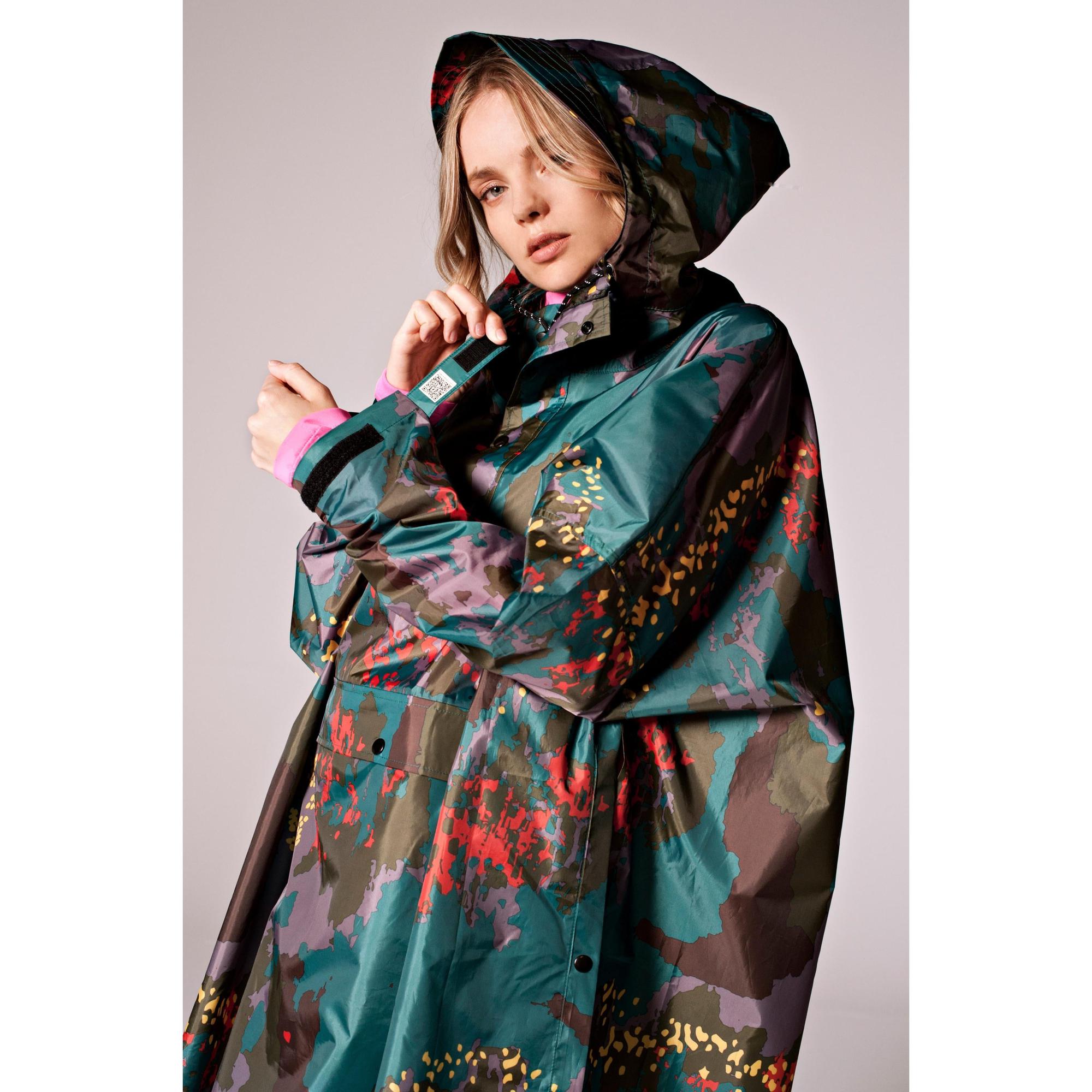 Rainkiss Digi Forest Camo rain poncho with hood, colorful digital camouflage pattern, lightweight waterproof material.