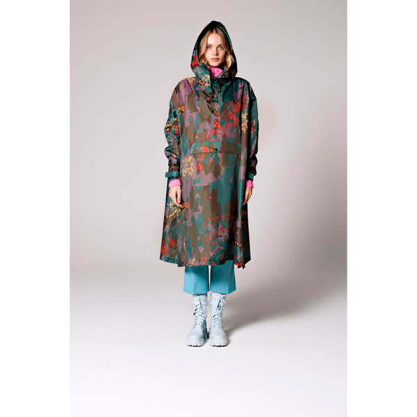 Rainkiss Digi Forest Camo rain poncho with hood, colorful camouflage print, long length, and white combat boots.