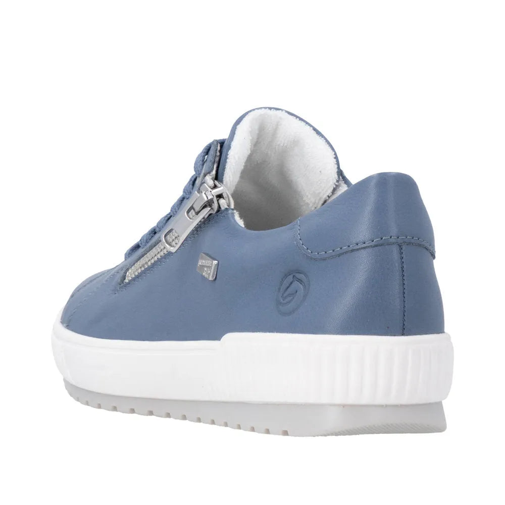 Blue leather shoes with zip and lace details, featuring a water-resistant design and white sole.