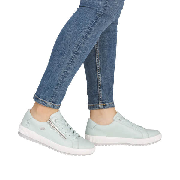 Ladies mint leather water-resistant sneakers with zip and lace closure, white soles, and casual style.