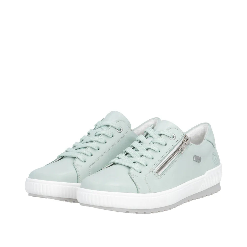 Mint leather water-resistant low-top sneakers with lace-up and side zipper detail, white soles, and soft interior.