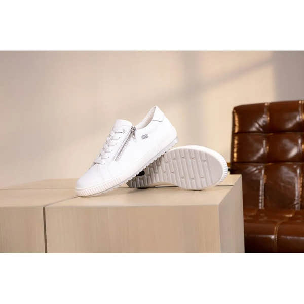 White leather water-resistant shoes with zip and lace design, featuring textured sole and lightweight style.