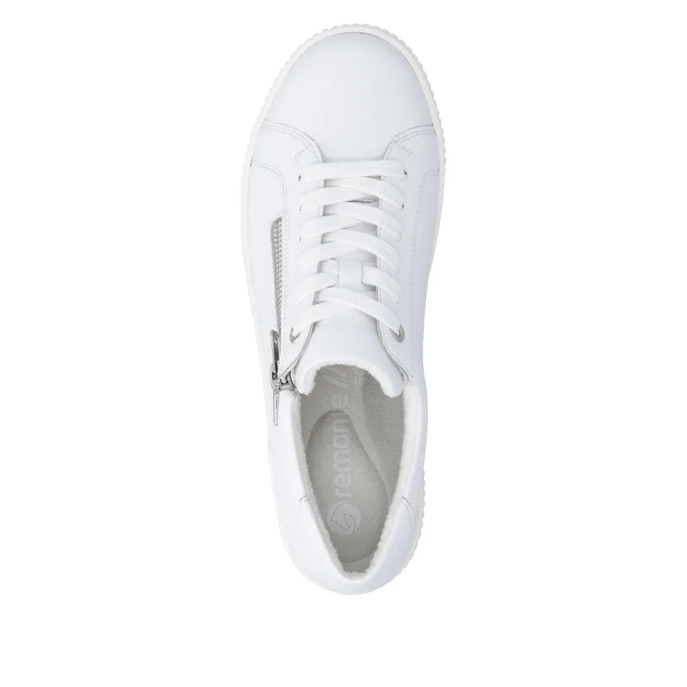 White leather ladies' shoes with lace and side zip detail, showcasing a sleek, sporty design ideal for casual wear.