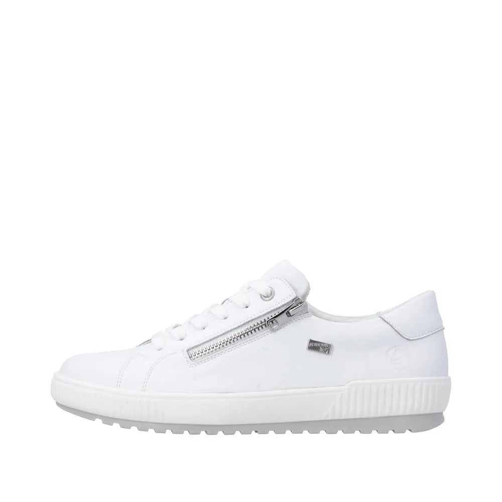 White leather water-resistant ladies' shoes featuring a zip and lace design with a textured sole.